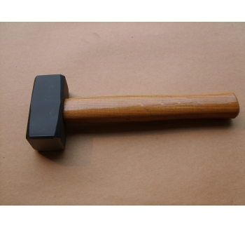Stoning hammer with wooden handle